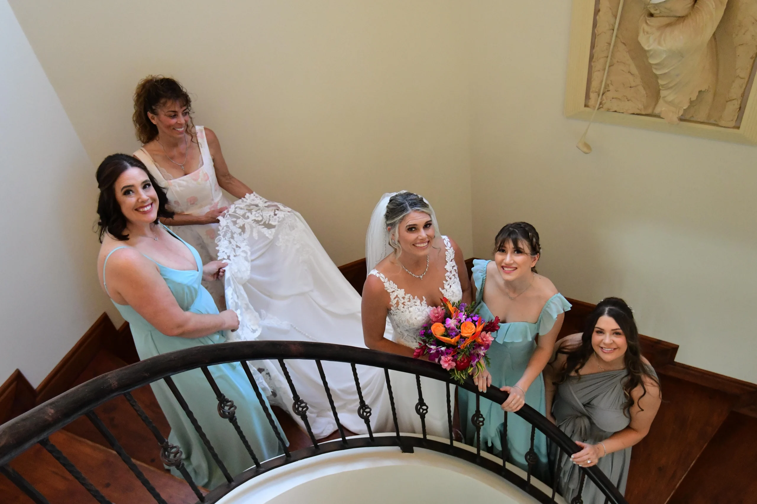 Bride and bridesmaids on the estate's grand staircase before the ceremony